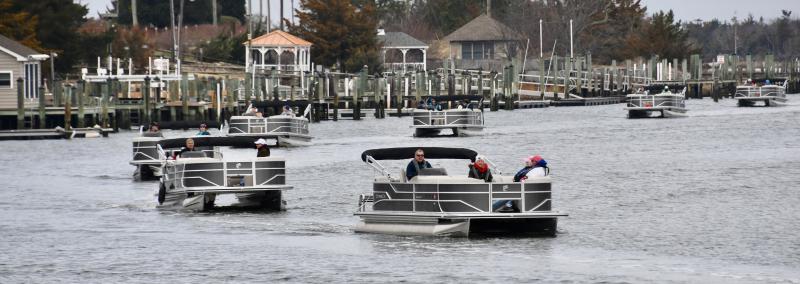The flotilla makes a turn on the Lewes-Rehoboth Canal at the start of the journey to Love Creek from Lewes.