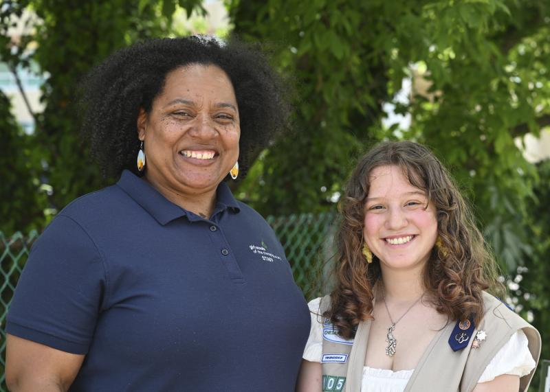 Dizza Whaley, associate director of programs and the Gold Award staff liaison for the Girl Scouts of the Chesapeake Bay, congratulates Adrianna Kollar.