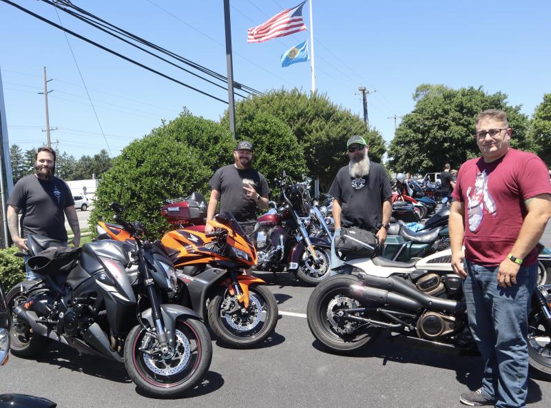 Attendees (l-r) Ivan Rios, Chris Horseman, Shane Webstern and Forrest Devine pose in front of their motorcycles.
