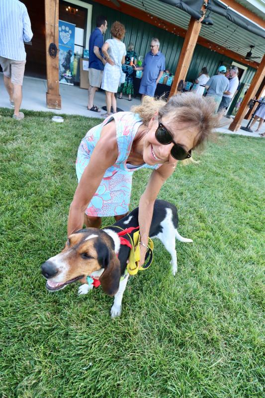 HAP volunteer Meryl Ludwig of Rehoboth Beach and Louise at Wags, Whiskers & Wine. Yes, there is a Thelma too. Both are up for adoption at Human Animal Partners in Rehoboth Beach.