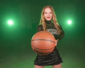 Cheerleader-Poses-with-Basketball