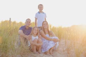 Family-Sits-in-Beach-Grass-at-Cape-Henlopen-State-Park-for-Fall-Photos